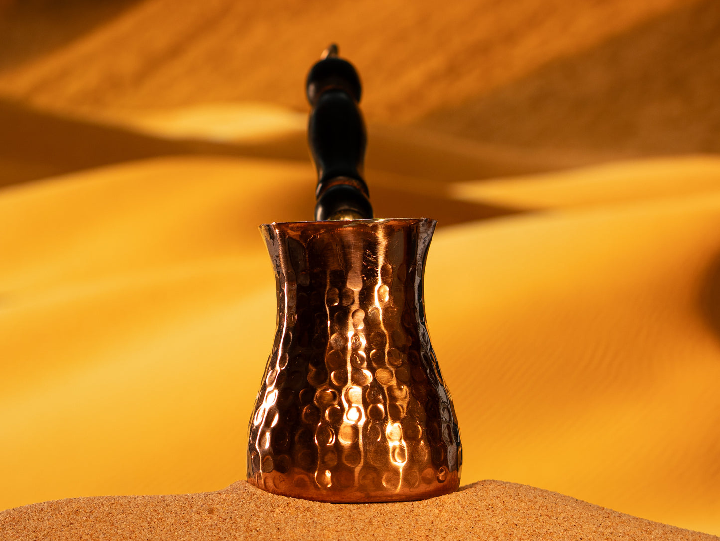 Close-up of the hand-hammered texture on a premium 2mm thick copper xhezve made near Istanbul.