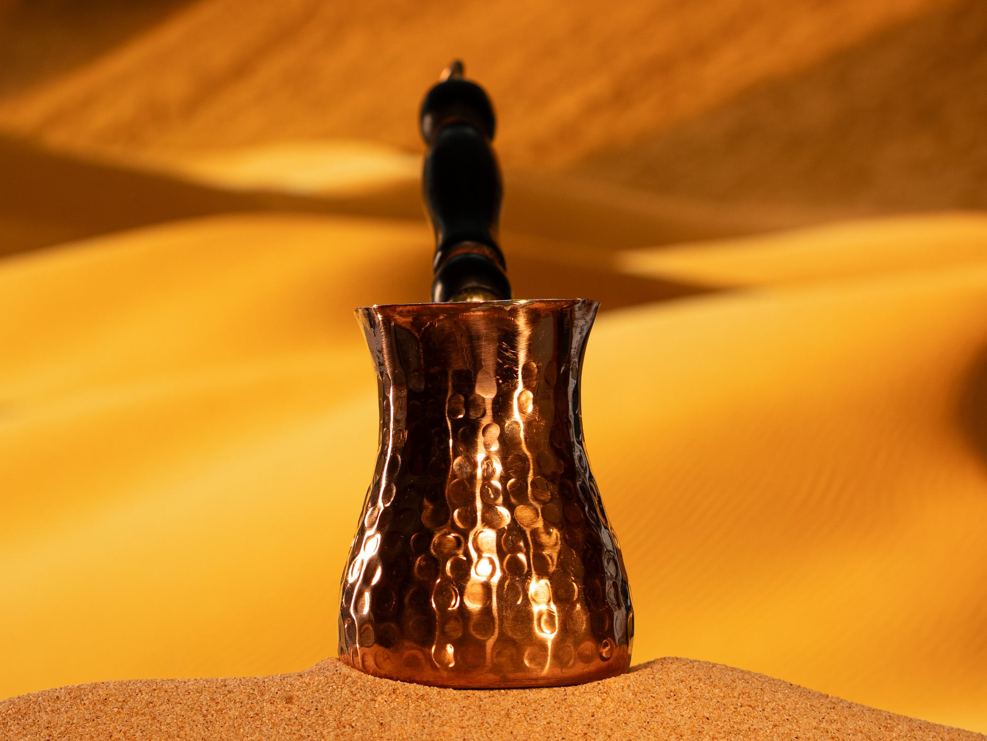 Close-up of the hand-hammered texture on a premium 2mm thick copper xhezve made near Istanbul.