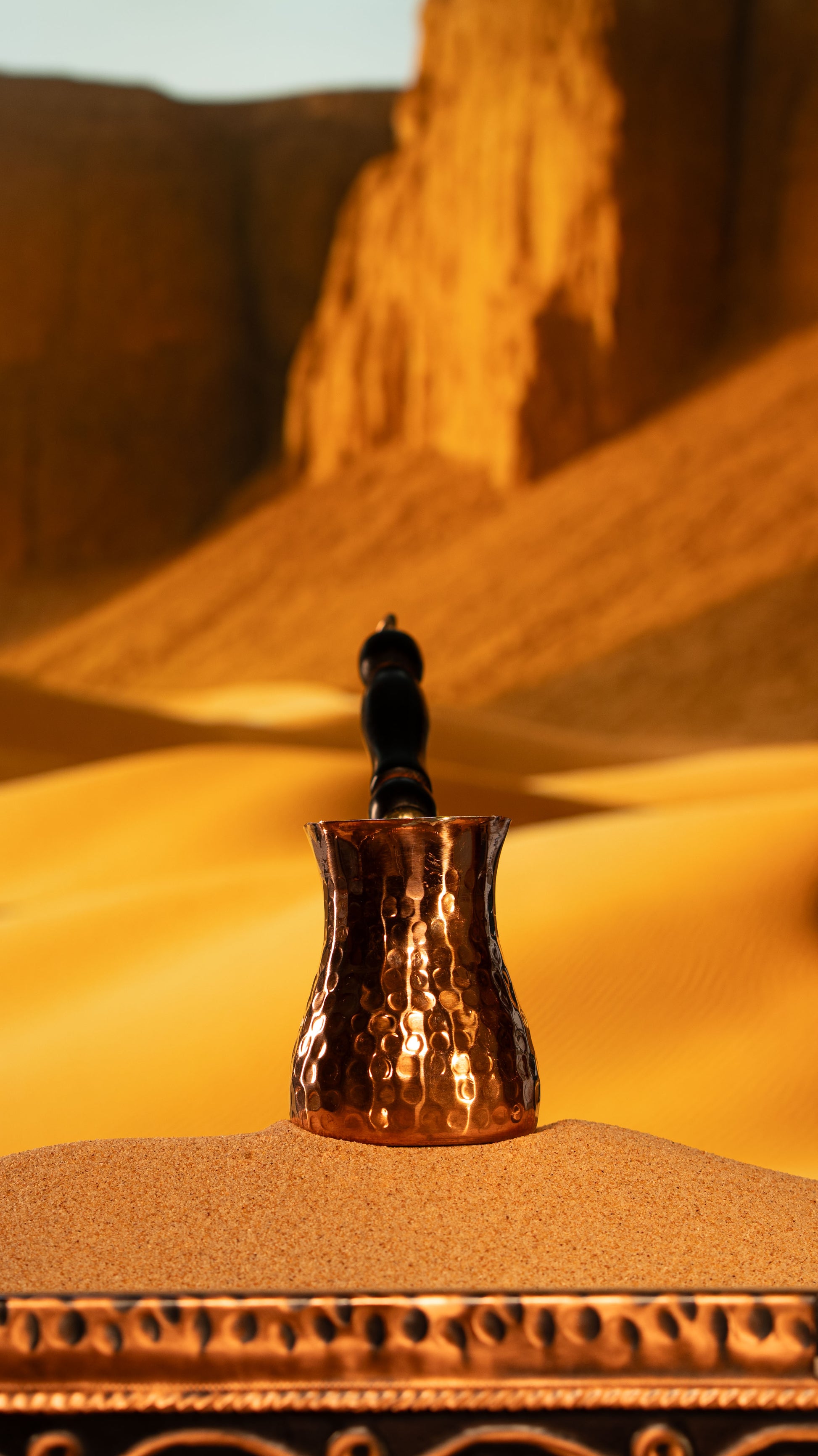 An exquisite copper xhezve designed for traditional sand-brewing, featuring a food-safe tin interior.