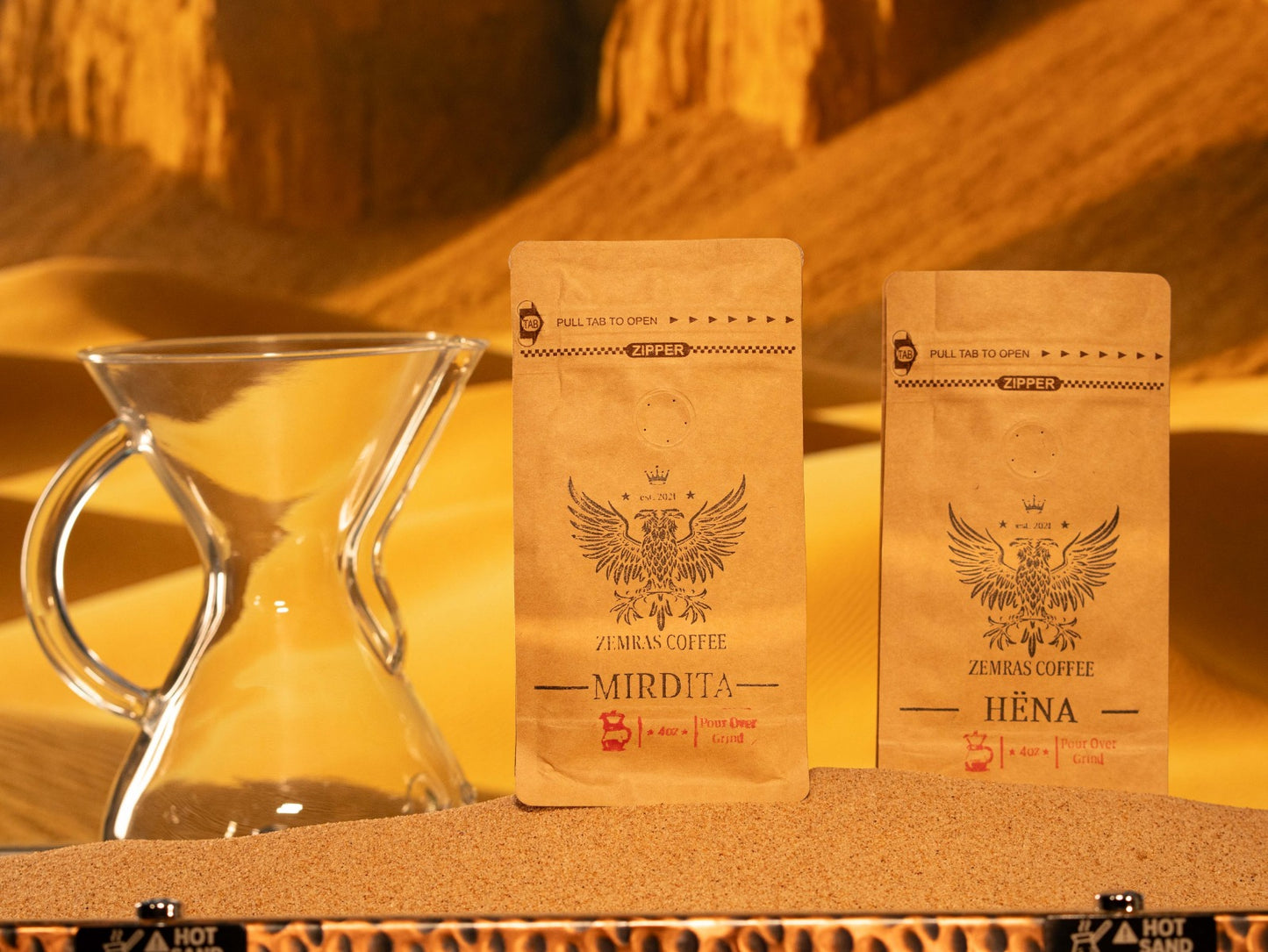 Mirdita dark roast and Hëna decaf coffee duo, showing both Albanian-inspired "Good Day" and "Moon" pour-over coffee bags.