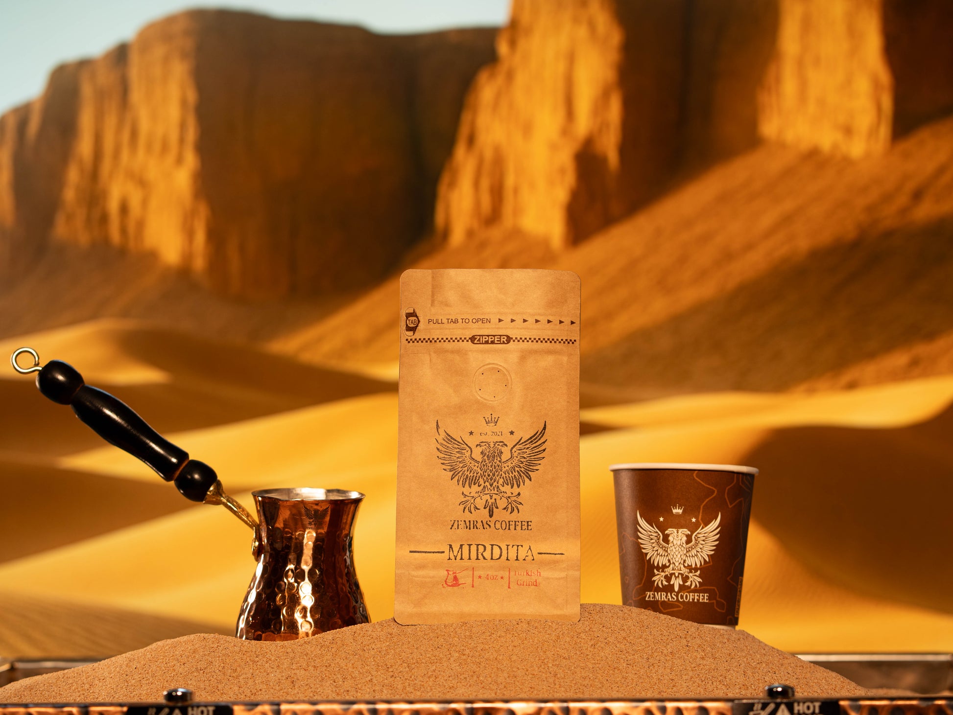 Mirdita Turkish coffee, cup, and xhezve on sand, roasted for a sweet, chocolaty finish.