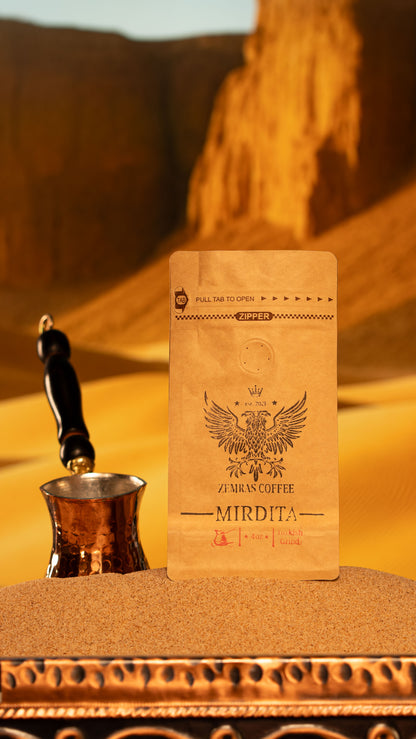 Vertical shot of Mirdita Turkish coffee bag with a copper xhezve, emphasizing the bold Colombian dark roast.