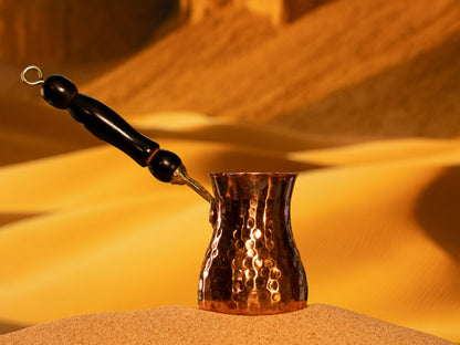 Side view of a 10-ounce heavy copper xhezve built for optimal heat retention and controlled boiling.