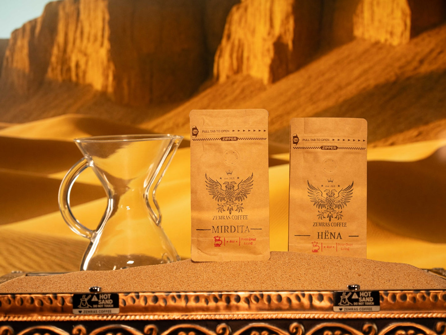 Mirdita and Hëna coffee set with a pour-over carafe, highlighting the medium-coarse grind and Mountain Water Process decaf.